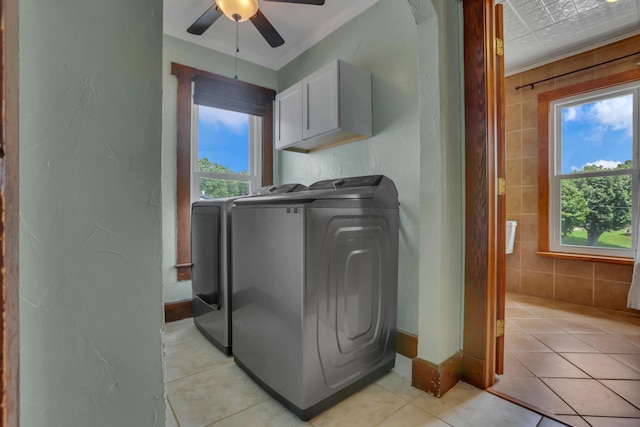 522 S Main St, New Lexington, OH 43764 - laundry room featuring washing machine and clothes dryer, cabinet space, ceiling fan, and light tile patterned floors