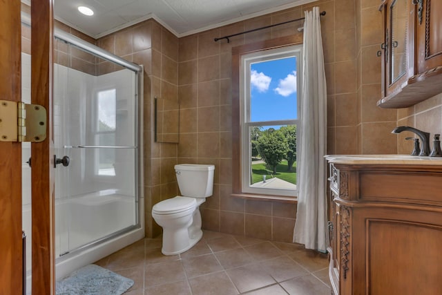 522 S Main St, New Lexington, OH 43764 - full bathroom featuring tile walls, tile patterned floors, a stall shower, and vanity
