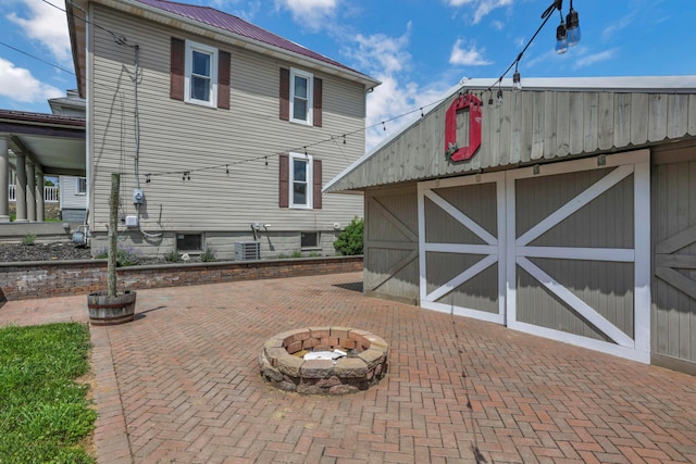522 S Main St, New Lexington, OH 43764 - view of patio / terrace with a fire pit and an outbuilding