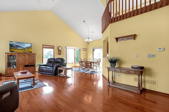12961 Arabian Ct, Pickerington, OH 43147 - living room with wood finished floors, high vaulted ceiling, and a chandelier