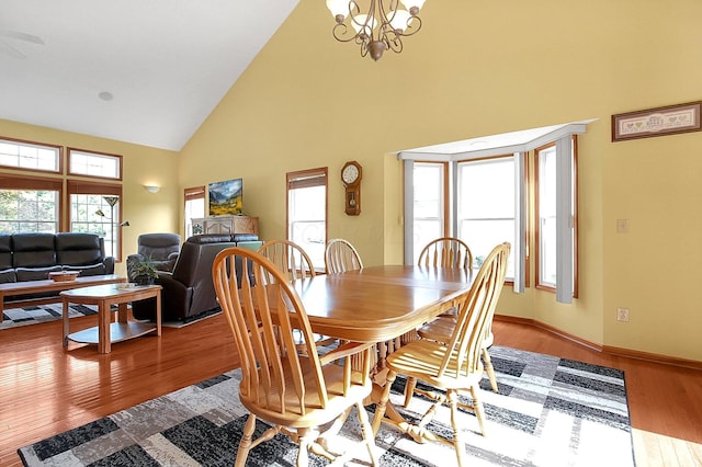 12961 Arabian Ct, Pickerington, OH 43147 - dining space featuring high vaulted ceiling, wood finished floors, and a chandelier