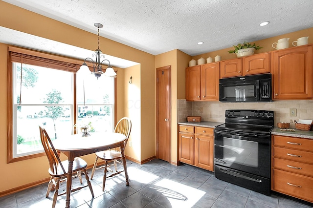 12961 Arabian Ct, Pickerington, OH 43147 - kitchen with black appliances, plenty of natural light, decorative backsplash, and a textured ceiling