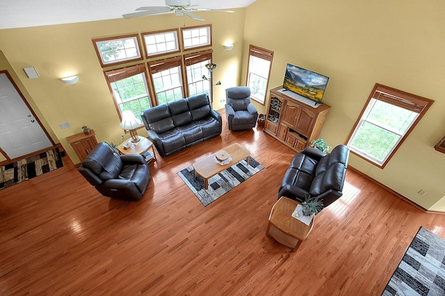 12961 Arabian Ct, Pickerington, OH 43147 - living room with ceiling fan, a high ceiling, and wood finished floors