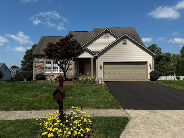 12961 Arabian Ct, Pickerington, OH 43147 - single story home with asphalt driveway, a front lawn, and an attached garage