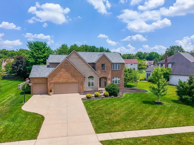 13191 Brandon Cir, Pickerington, OH 43147 - view of front of home with brick siding, a garage, a front lawn, driveway, and roof with shingles