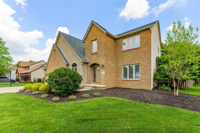 13191 Brandon Cir, Pickerington, OH 43147 - view of front of property with brick siding and a front lawn