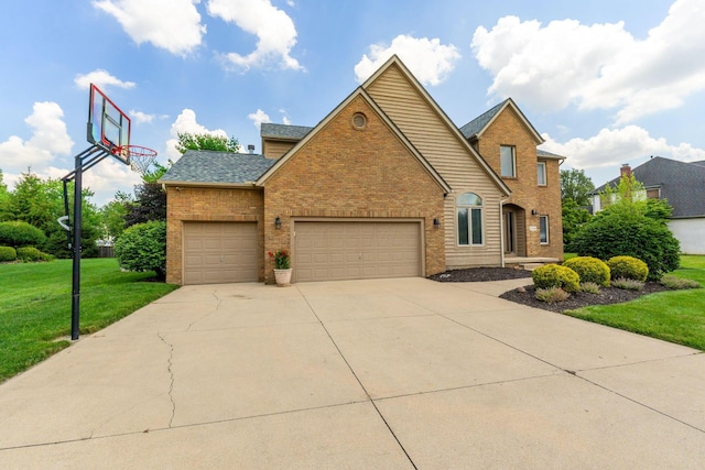 13191 Brandon Cir, Pickerington, OH 43147 - traditional-style house featuring brick siding, a front yard, a garage, concrete driveway, and roof with shingles