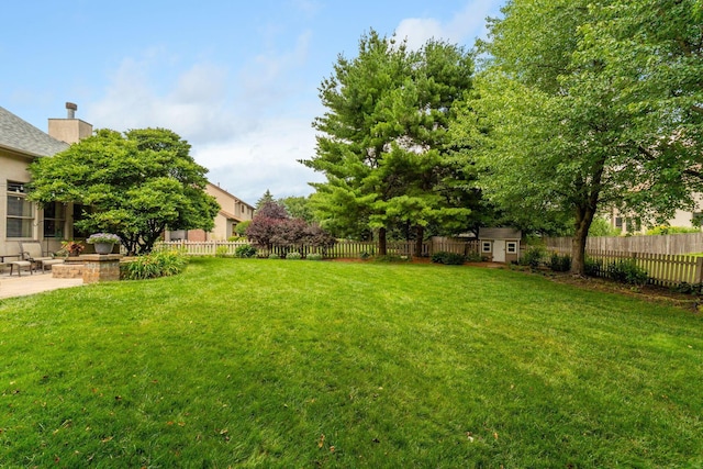 13191 Brandon Cir, Pickerington, OH 43147 - fenced backyard with a storage unit and a patio