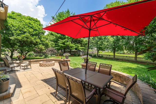 13191 Brandon Cir, Pickerington, OH 43147 - fenced backyard featuring a fire pit, a patio area, and outdoor dining area