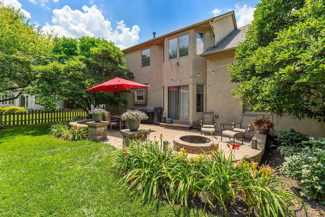 13191 Brandon Cir, Pickerington, OH 43147 - back of property with an outdoor fire pit, stucco siding, and a patio
