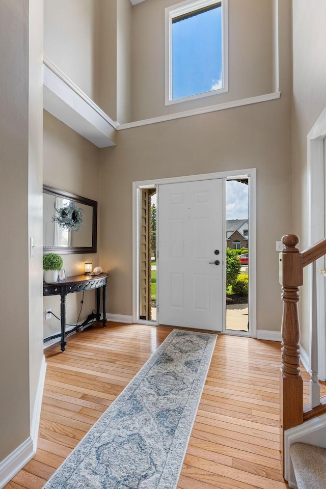13191 Brandon Cir, Pickerington, OH 43147 - foyer featuring a towering ceiling, healthy amount of natural light, and wood finished floors