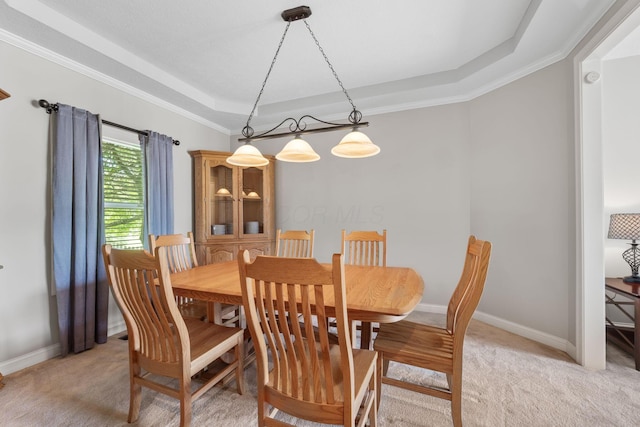 13191 Brandon Cir, Pickerington, OH 43147 - dining space featuring a tray ceiling, light colored carpet, and crown molding