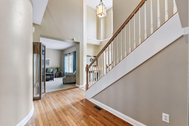 13191 Brandon Cir, Pickerington, OH 43147 - foyer entrance with hardwood / wood-style flooring, stairs, and a high ceiling