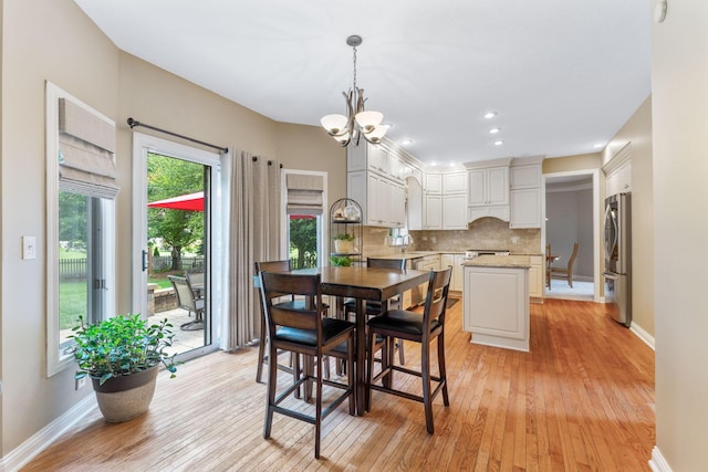 13191 Brandon Cir, Pickerington, OH 43147 - dining space featuring light wood-style flooring, a chandelier, and recessed lighting