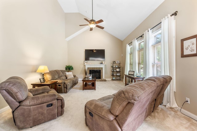 13191 Brandon Cir, Pickerington, OH 43147 - living room with light carpet, ceiling fan, a fireplace, and high vaulted ceiling