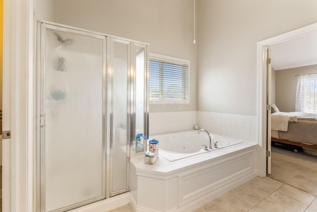 13191 Brandon Cir, Pickerington, OH 43147 - full bathroom with connected bathroom, a whirlpool tub, a stall shower, and tile patterned floors