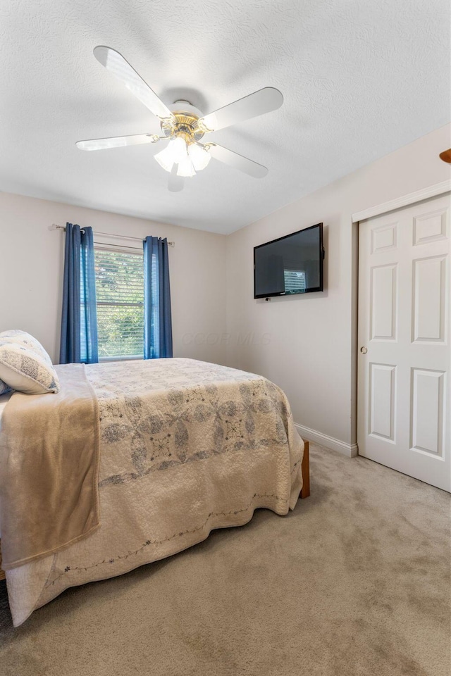 13191 Brandon Cir, Pickerington, OH 43147 - bedroom with ceiling fan, a textured ceiling, and carpet