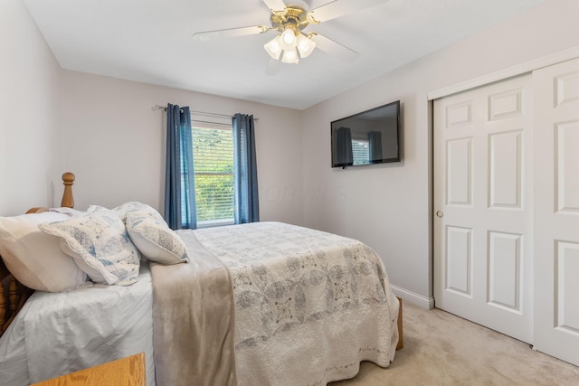 13191 Brandon Cir, Pickerington, OH 43147 - bedroom with light carpet, ceiling fan, and a closet