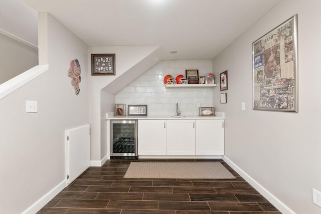 13191 Brandon Cir, Pickerington, OH 43147 - indoor wet bar featuring wine cooler, wood finish floors, and backsplash