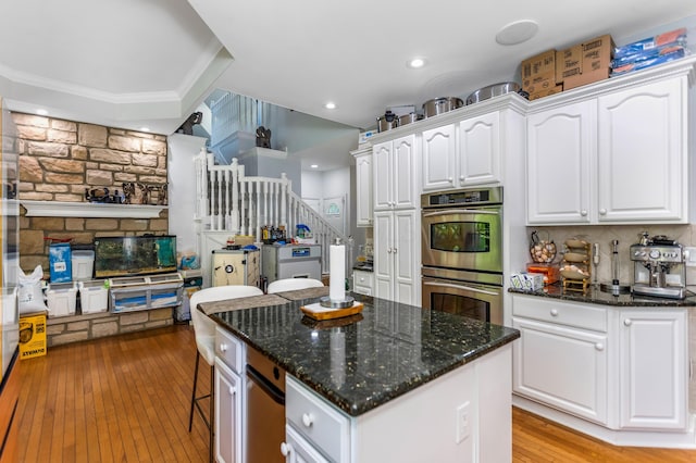 1800 Lynnbrook Ct, Orient, OH 43146 - kitchen featuring double oven, white cabinetry, a kitchen island, light wood-type flooring, and recessed lighting