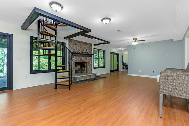 1800 Lynnbrook Ct, Orient, OH 43146 - unfurnished living room featuring wood finished floors, ceiling fan, and a fireplace
