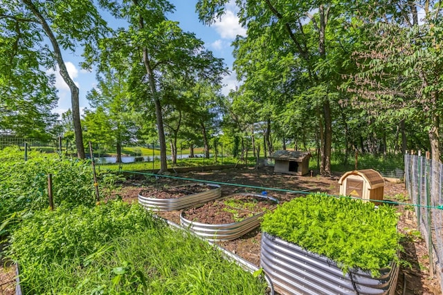 1800 Lynnbrook Ct, Orient, OH 43146 - view of yard with a shed, a garden, a water view, and view of wooded area