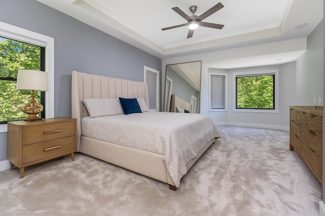 1800 Lynnbrook Ct, Orient, OH 43146 - bedroom featuring light carpet, multiple windows, a tray ceiling, crown molding, and a ceiling fan