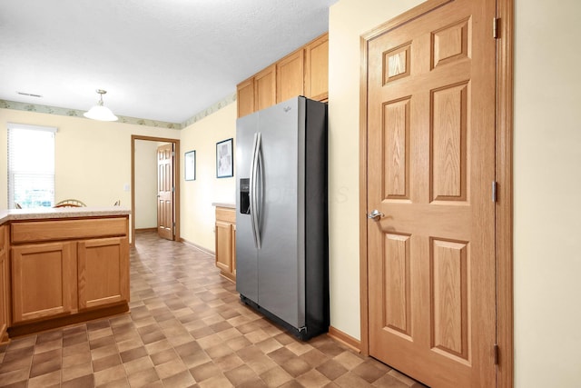 6817 Riding Trail Dr, Canal Winchester, OH 43110 - kitchen with stainless steel refrigerator with ice dispenser, light countertops, light flooring, and pendant lighting