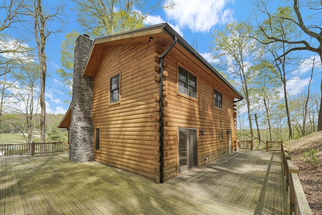 1607 Kato Ln, Sugar Grove, OH 43155 - view of home's exterior featuring log siding, a chimney, and a wooden deck