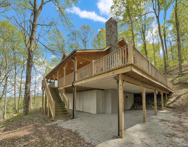 1607 Kato Ln, Sugar Grove, OH 43155 - back of property featuring stairway, a wooden deck, and a carport