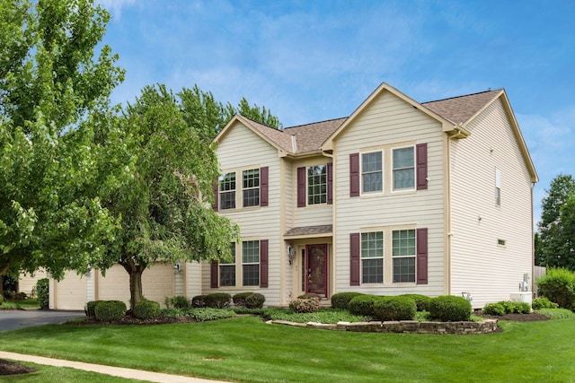 5630 Dorshire Dr, Galena, OH 43021 - view of front of home with a front yard, asphalt driveway, and a shingled roof
