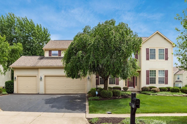 5630 Dorshire Dr, Galena, OH 43021 - view of front of house with driveway, a front yard, an attached garage, and roof with shingles