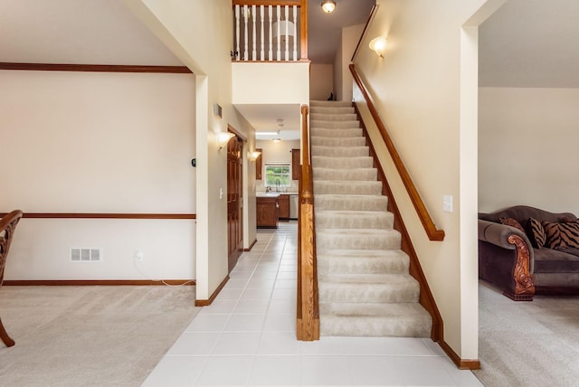 5630 Dorshire Dr, Galena, OH 43021 - stairs with carpet floors, tile patterned floors, and a high ceiling