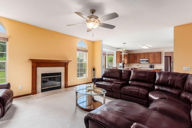 5630 Dorshire Dr, Galena, OH 43021 - living area featuring a fireplace, ceiling fan, and light carpet