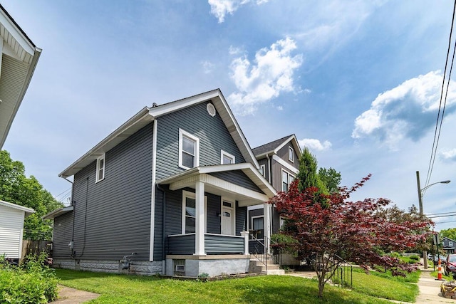 1382 S 5th St, Columbus, OH 43207 - view of front of property featuring a porch and a front lawn