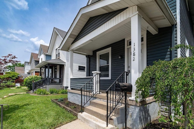 1382 S 5th St, Columbus, OH 43207 - doorway to property featuring covered porch and a yard