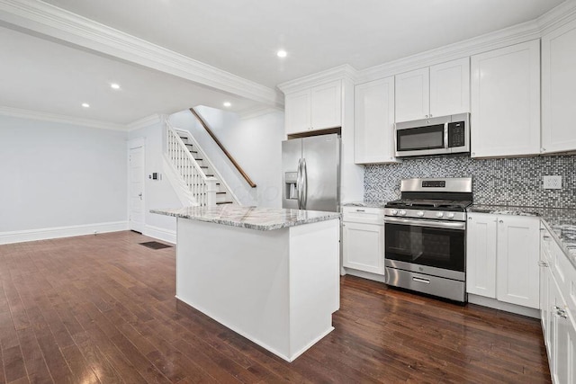 1382 S 5th St, Columbus, OH 43207 - kitchen featuring stainless steel appliances, tasteful backsplash, white cabinets, dark wood finished floors, and recessed lighting