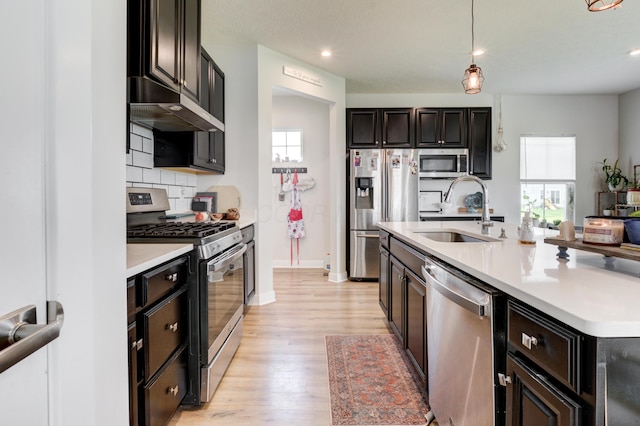 225 Messenger Way, Lewis Center, OH 43035 - kitchen with stainless steel appliances, under cabinet range hood, healthy amount of natural light, light countertops, and recessed lighting