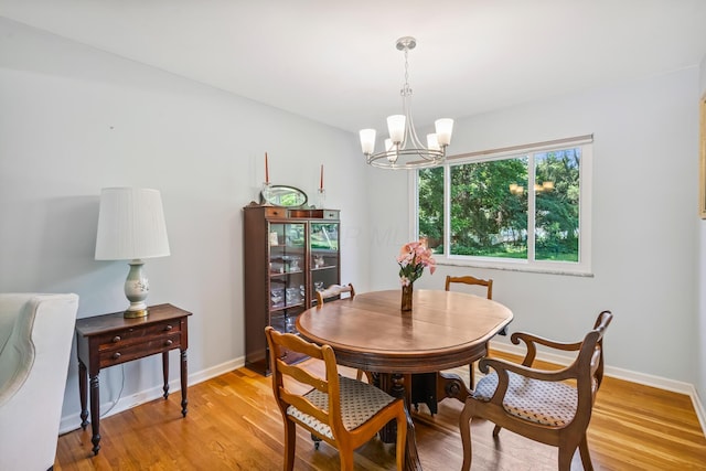 6750 Schreiner St E, Worthington, OH 43085 - dining room with a chandelier and light wood-style flooring