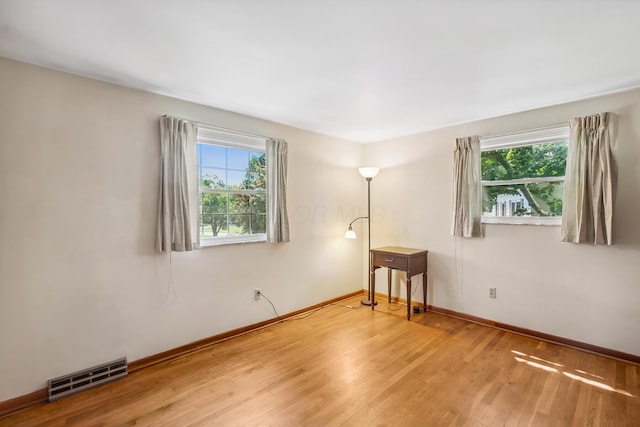 6750 Schreiner St E, Worthington, OH 43085 - spare room featuring wood finished floors and baseboards