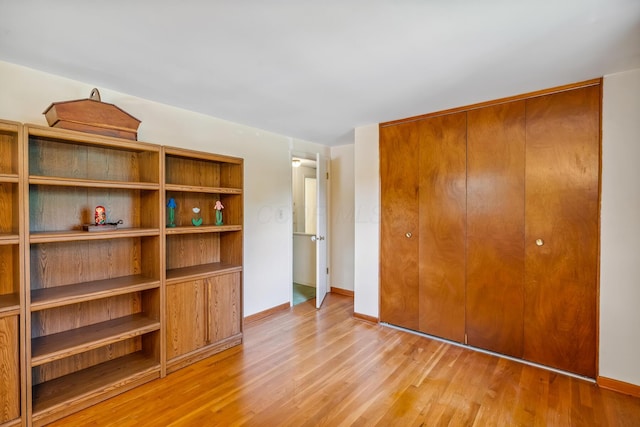 6750 Schreiner St E, Worthington, OH 43085 - unfurnished bedroom with light wood-style flooring and a closet