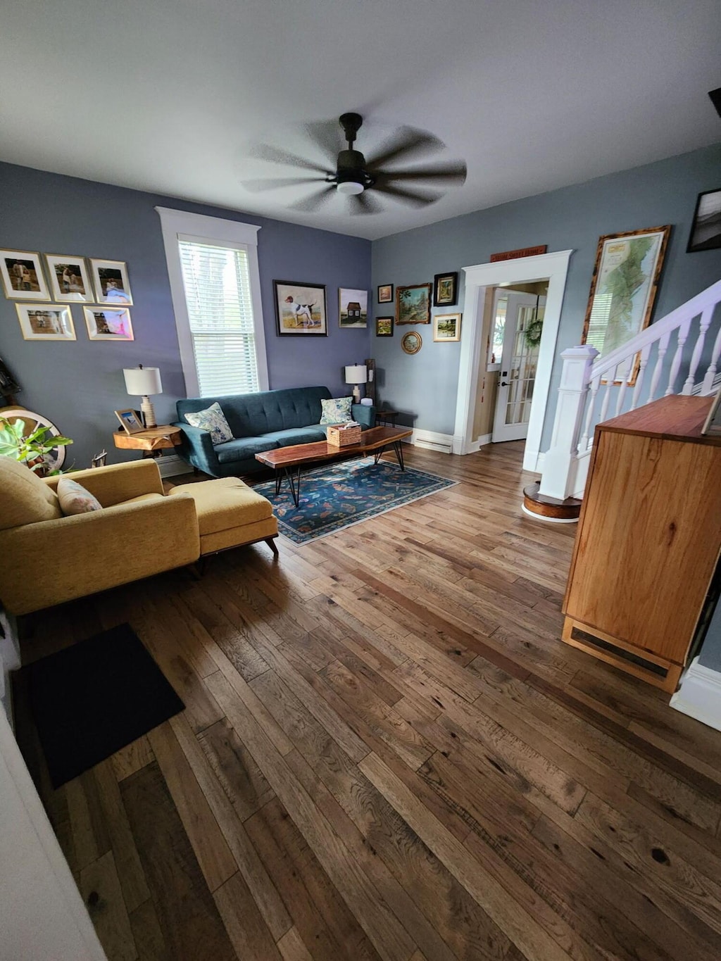 1183 N Columbus St, Lancaster, OH 43130 - living area featuring hardwood / wood-style floors, a ceiling fan, and stairway