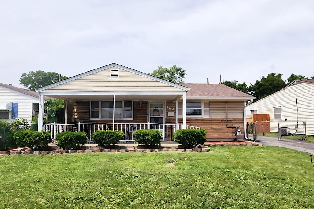 164 E Alcott Rd, Columbus, OH 43207 - view of front of house with a gate and covered porch