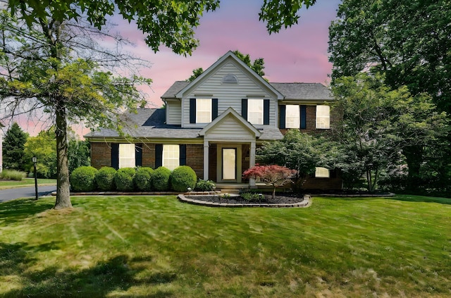 7672 Tullymore Dr, Dublin, OH 43016 - view of front of property with a lawn and brick siding