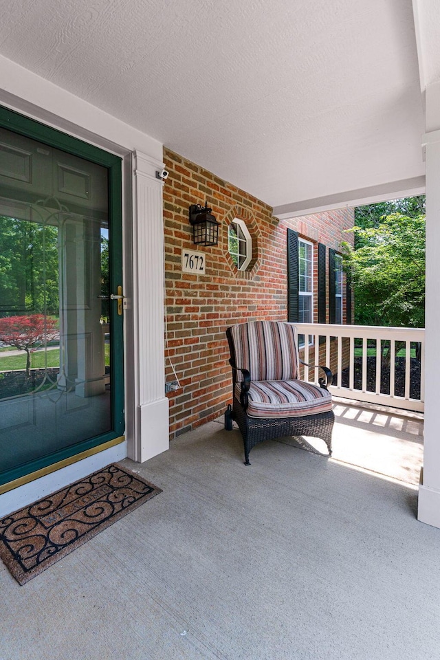 7672 Tullymore Dr, Dublin, OH 43016 - property entrance with brick siding and a porch
