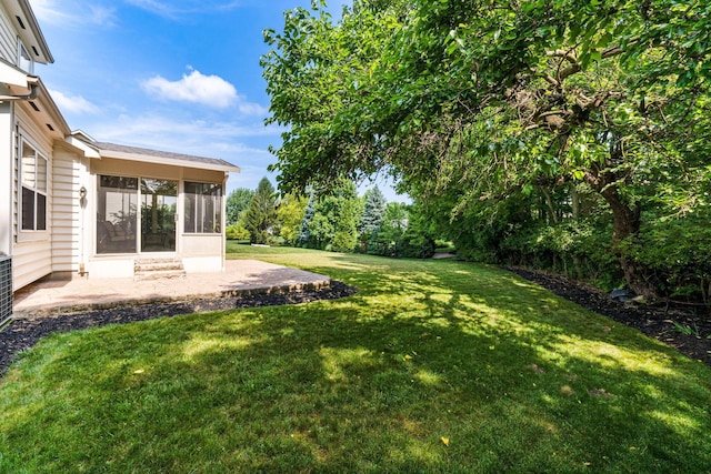 7672 Tullymore Dr, Dublin, OH 43016 - view of green lawn with a sunroom and a patio area