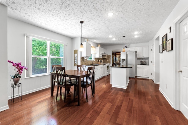 7672 Tullymore Dr, Dublin, OH 43016 - dining area featuring dark wood-style flooring, recessed lighting, and a textured ceiling