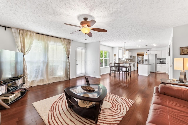 7672 Tullymore Dr, Dublin, OH 43016 - living area with ceiling fan, a textured ceiling, dark wood-style flooring, and recessed lighting