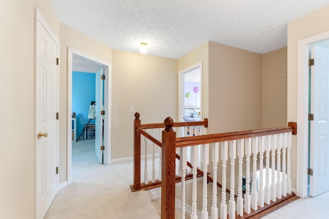 7672 Tullymore Dr, Dublin, OH 43016 - hall with an upstairs landing, light colored carpet, and a textured ceiling