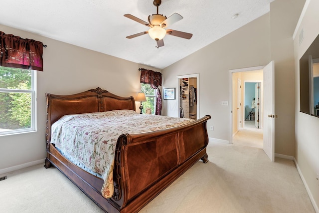 7672 Tullymore Dr, Dublin, OH 43016 - bedroom with light carpet, vaulted ceiling, a spacious closet, a ceiling fan, and a closet